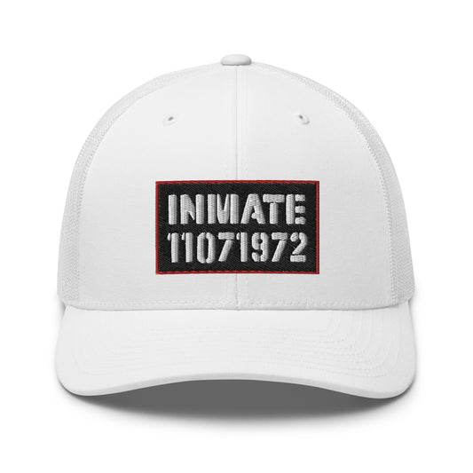 6-panel white cap with the word 'inmate' along with an inmate number embroidered on the front